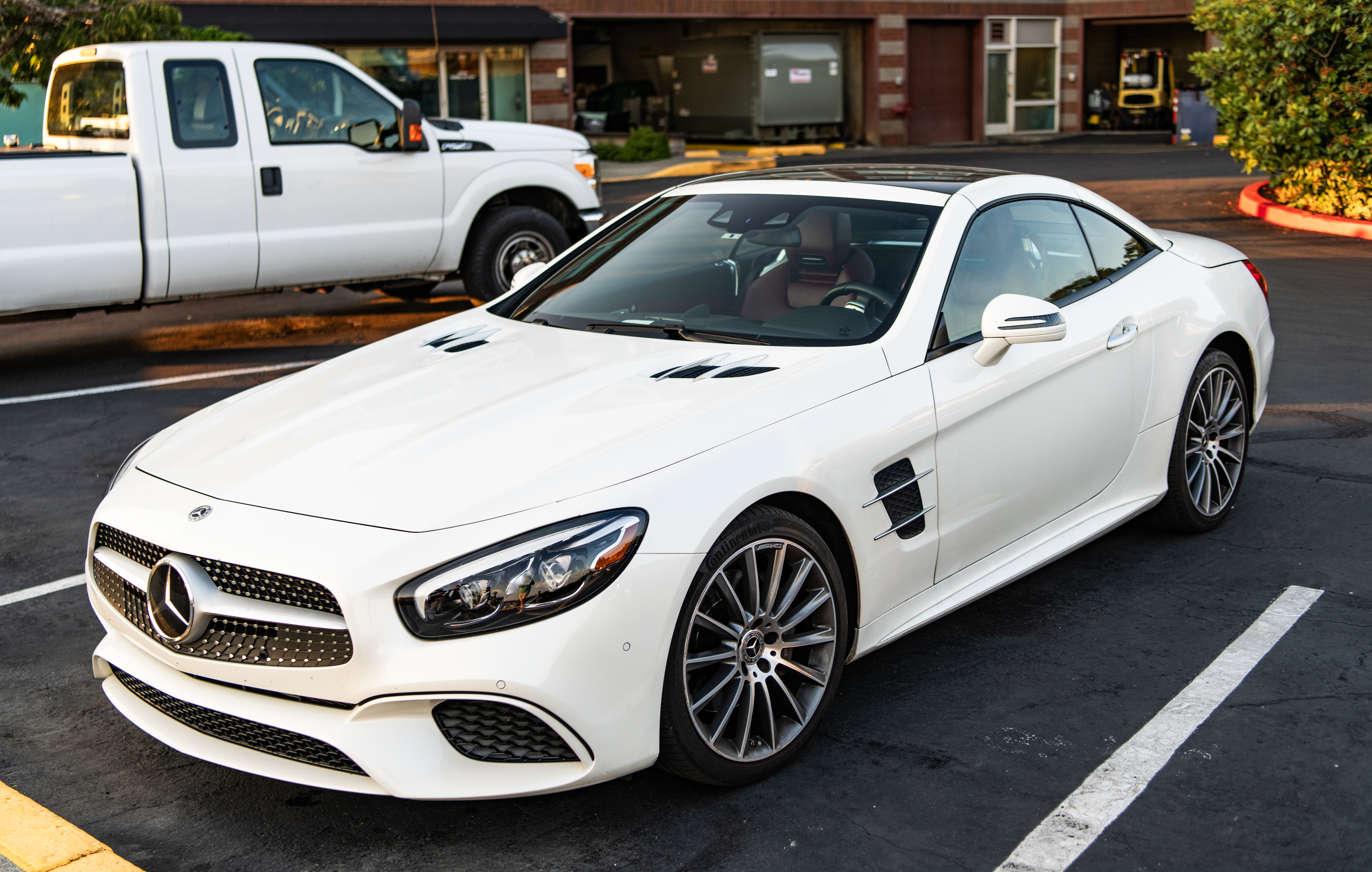 Seattle, WA, USA -July 2, 2024: 2017 Mercedes Benz SL Class SL 550 white color convertible.